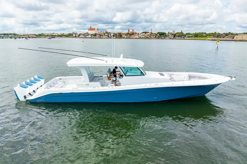  Yacht Photos Pics 2026 HCB 56 Suenos GIX boat on calm water, featuring sleek design and multiple engines.