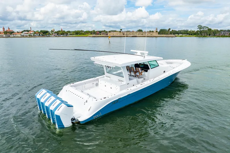  Yacht Photos Pics 2026 HCB 56 Suenos GIX boat on calm water, featuring multiple outboard engines.