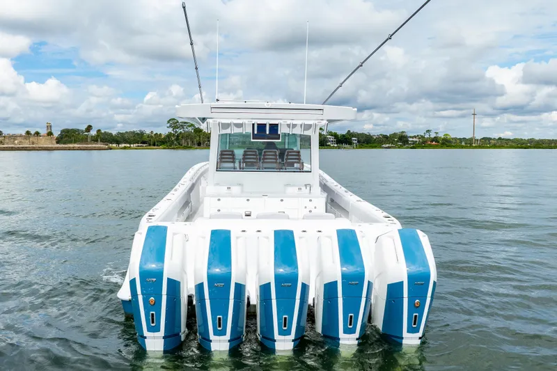  Yacht Photos Pics 2026 HCB 56 Suenos GIX boat with multiple engines on calm water.