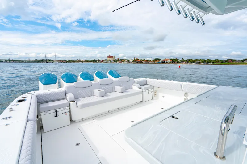  Yacht Photos Pics 2026 HCB 56 Suenos GIX luxury boat with spacious deck and seating on calm waters.