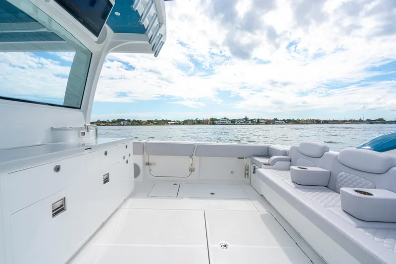  Yacht Photos Pics Luxurious 2026 HCB 56 Suenos GIX yacht interior with sleek seating and ocean view.