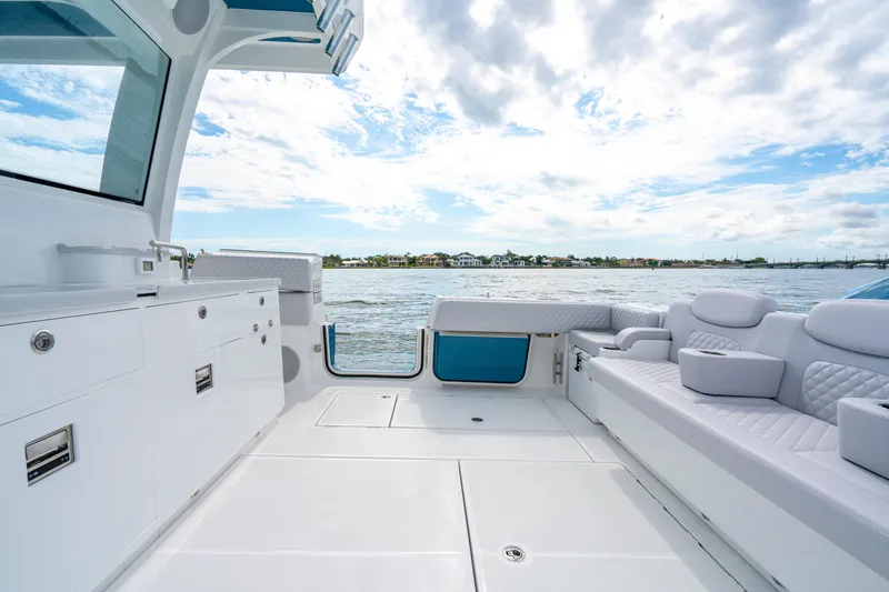  Yacht Photos Pics Luxurious interior of 2026 HCB 56 Suenos GIX yacht with plush seating and ocean view.