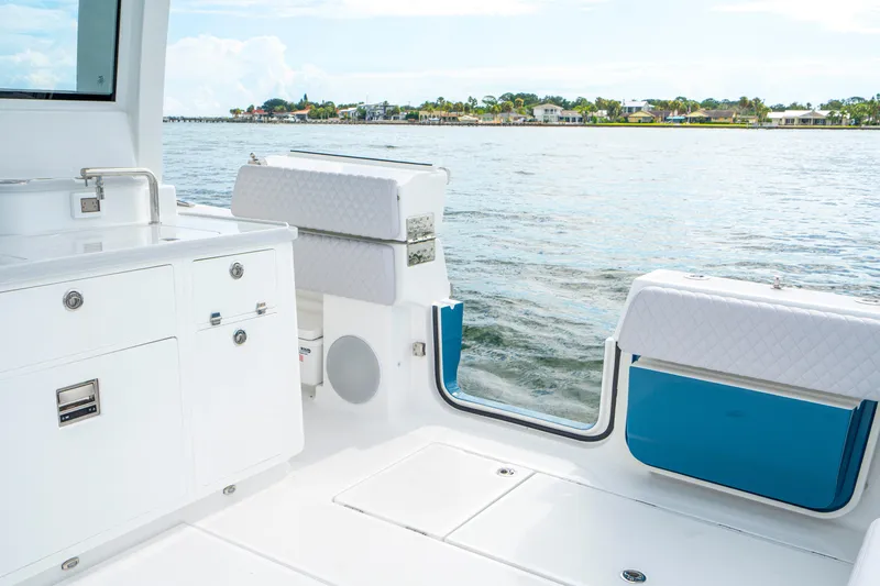  Yacht Photos Pics 2026 HCB 56 Suenos GIX boat interior with sleek white cabinetry and waterfront view.