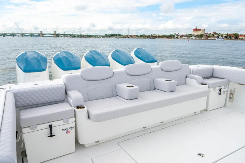  Yacht Photos Pics Luxurious seating on 2026 HCB 56 Suenos GIX boat with scenic waterfront view.