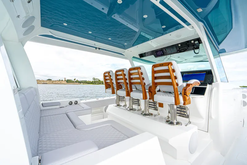  Yacht Photos Pics Luxurious interior of 2026 HCB 56 Suenos GIX yacht with elegant seating and modern controls.