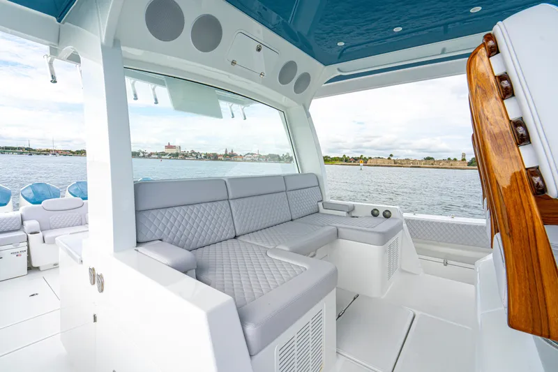  Yacht Photos Pics Luxurious interior of 2026 HCB 56 Suenos GIX yacht with plush seating and scenic water view.