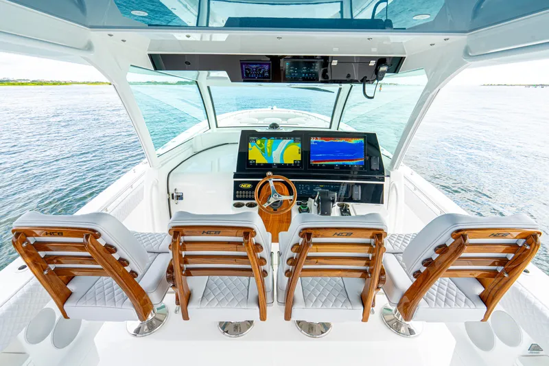  Yacht Photos Pics Helm of 2026 HCB 56 Suenos GIX with advanced navigation displays and luxurious seating.