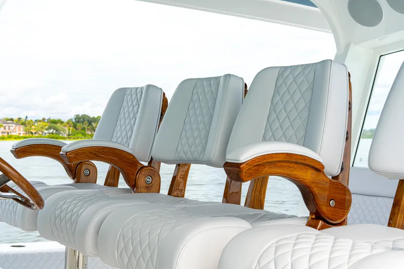  Yacht Photos Pics Luxurious seating on 2026 HCB 56 Suenos GIX yacht with elegant wood and leather design.
