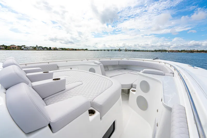  Yacht Photos Pics Luxurious 2026 HCB 56 Suenos GIX yacht interior with plush seating, overlooking serene waters.