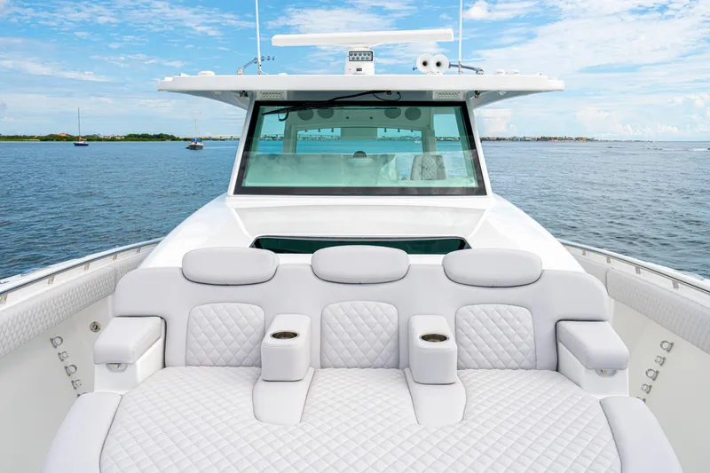  Yacht Photos Pics Luxurious seating on 2026 HCB 56 Suenos GIX yacht, ocean view backdrop.