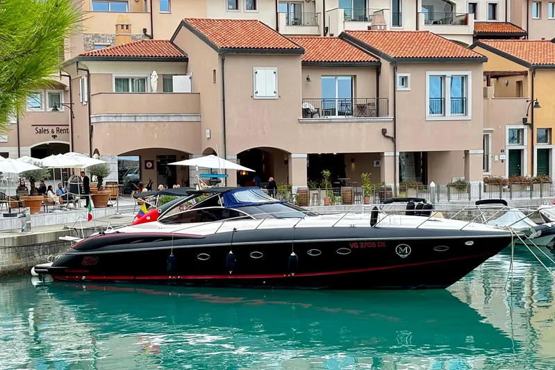  Yacht Photos Pics Sunseeker Predator 58 yacht docked near waterfront buildings, 2000 model.