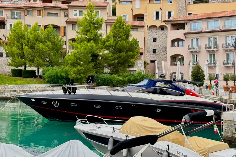 Yacht Photos Pics Luxury Sunseeker Predator 58 yacht docked in scenic marina, 2000 model.