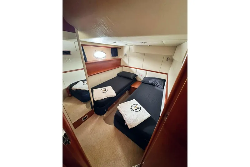  Yacht Photos Pics Luxurious twin cabin interior of 2000 Sunseeker Predator 58 yacht.