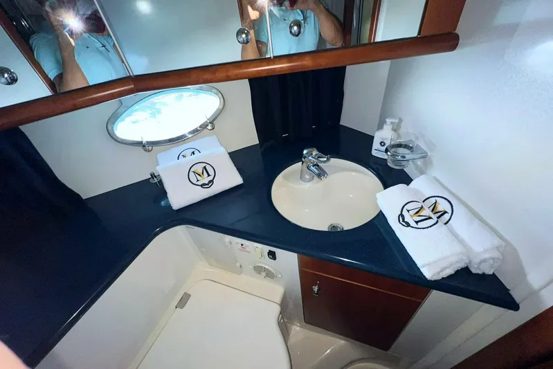  Yacht Photos Pics Luxurious bathroom in 2000 Sunseeker Predator 58 yacht with elegant sink and towels.