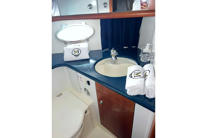  Yacht Photos Pics Bathroom interior of 2000 Sunseeker Predator 58 yacht with sink and towels.