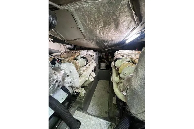  Yacht Photos Pics Engine room of a 2000 Sunseeker Predator 58 yacht, showcasing dual engines.