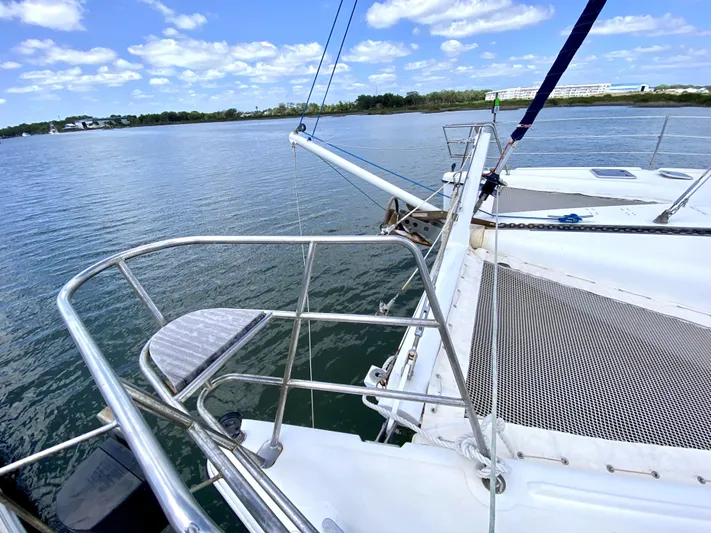 Rock N' No Roll Yacht Photos Pics Sailing catamaran Privilege 435, 2006 model, on calm waters under a blue sky.