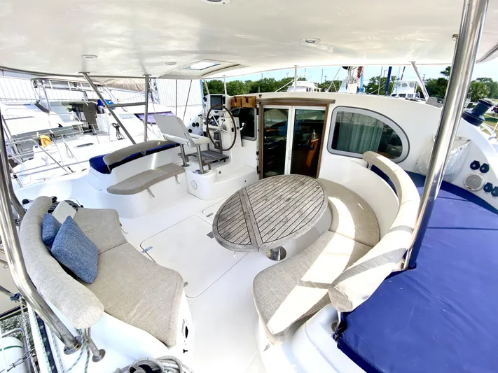 Rock N' No Roll Yacht Photos Pics Spacious 2006 Privilege 435 yacht deck with seating and steering area.