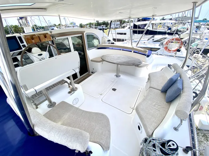 Rock N' No Roll Yacht Photos Pics Spacious deck of 2006 Privilege 435 yacht with comfortable seating and table.
