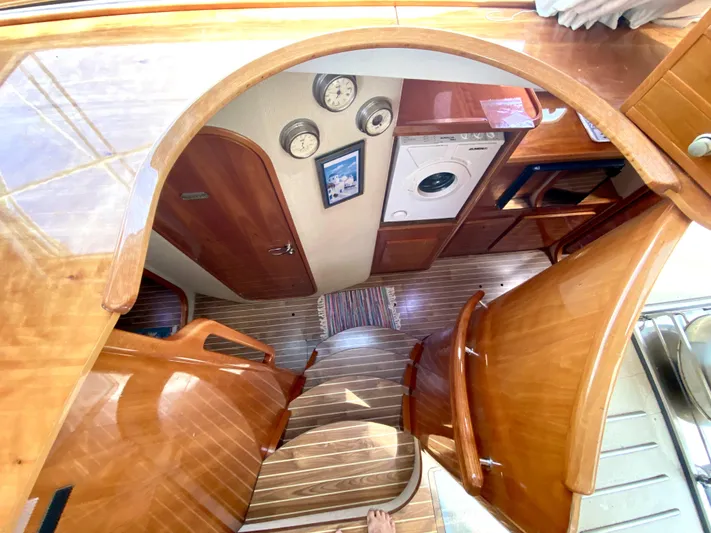 Rock N' No Roll Yacht Photos Pics Interior of 2006 Privilege 435 yacht with wooden finish and built-in appliances.