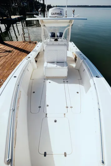  Yacht Photos Pics 2006 Yellowfin 31 CC boat docked, featuring spacious deck and Garmin equipment.