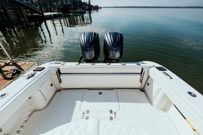  Yacht Photos Pics 2006 Yellowfin 31 CC boat with dual engines on calm water.