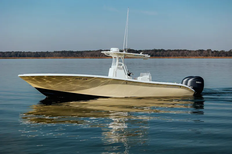  Yacht Photos Pics 2006 Yellowfin 31 CC boat on calm water, side view.