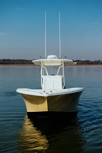  Yacht Photos Pics 2006 Yellowfin 31 CC boat on calm water, front view, clear sky.