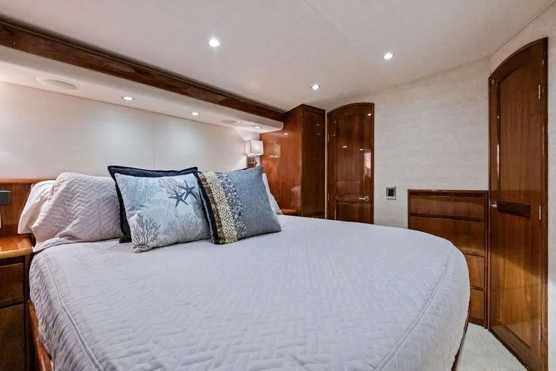 Sexy Lady Yacht Photos Pics Luxurious bedroom interior of 2017 Viking 62 Convertible yacht with elegant wood finishes.