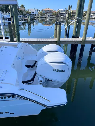  Yacht Photos Pics 2023 Grady-White Freedom 325 boat with Yamaha engines docked in a marina.