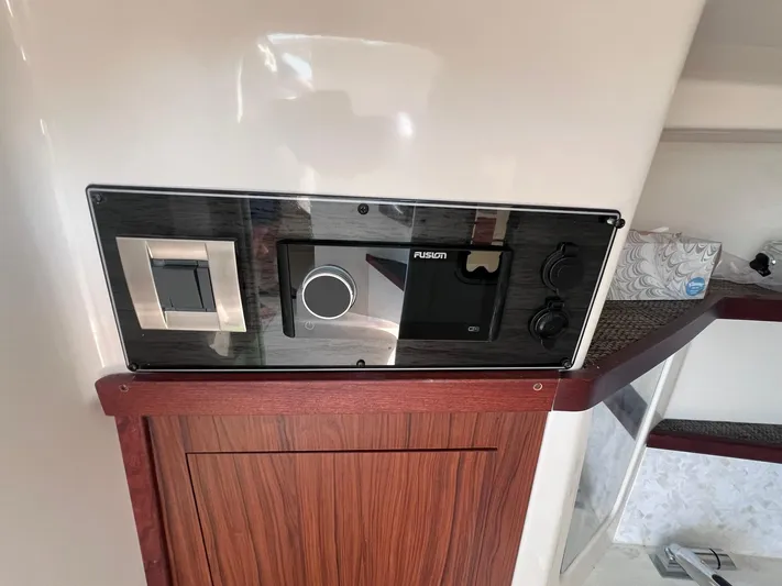  Yacht Photos Pics Control panel on 2023 Grady-White Freedom 325 boat, featuring modern design and wood accents.