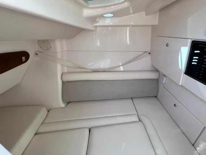  Yacht Photos Pics 2023 Grady-White Freedom 325 cabin interior with cushioned seating and storage compartments.