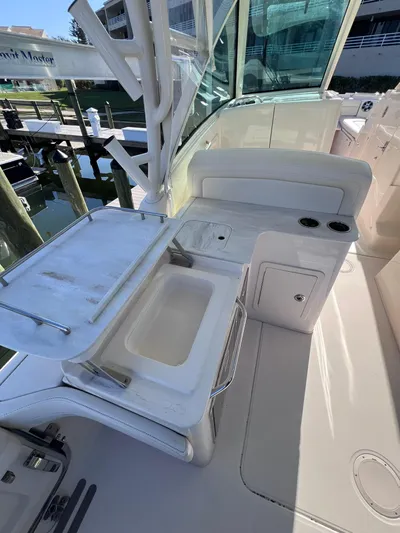  Yacht Photos Pics 2023 Grady-White Freedom 325 boat interior with sink and storage area.