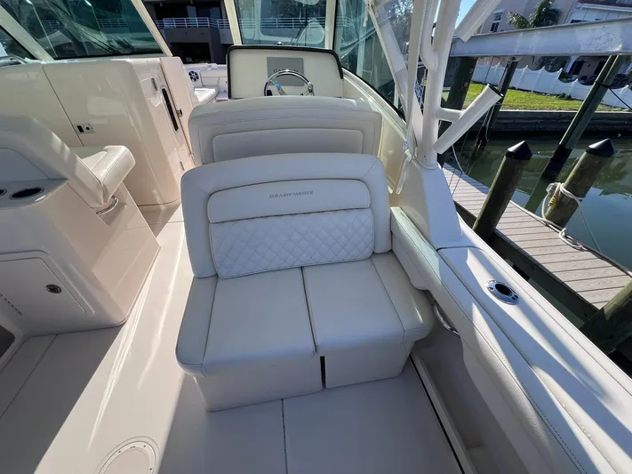  Yacht Photos Pics 2023 Grady-White Freedom 325 boat interior with luxurious seating and helm.