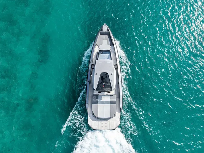 Mako Yacht Photos Pics Aerial view of 2024 Maori M46 yacht cruising in clear turquoise waters.