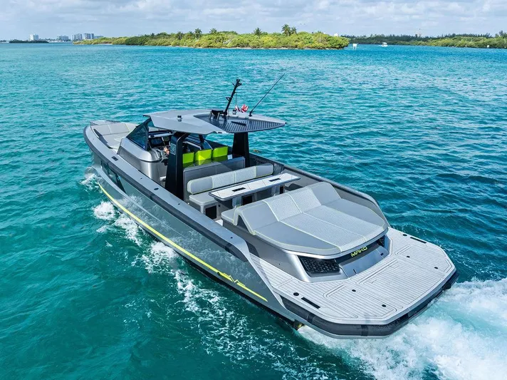 Mako Yacht Photos Pics 2024 Maori M46 yacht cruising on turquoise waters near lush green islands.