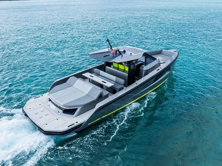 Mako Yacht Photos Pics 2024 Maori M46 boat cruising on clear blue water, showcasing sleek design and modern features.