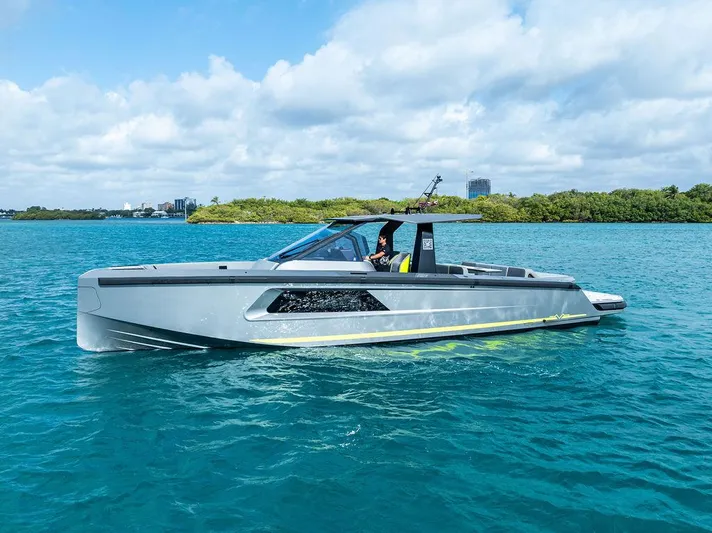 Mako Yacht Photos Pics 2024 Maori M46 yacht cruising on clear blue water under a partly cloudy sky.