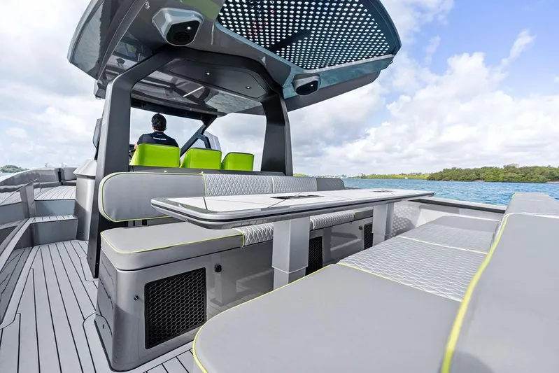 Mako Yacht Photos Pics 2024 Maori M46 boat with modern seating and sleek design on open water.