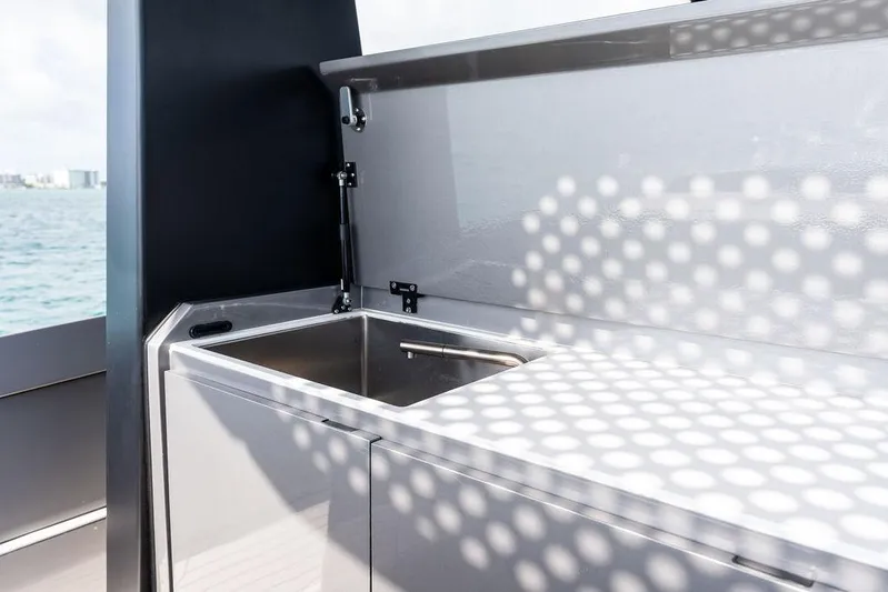 Mako Yacht Photos Pics Modern kitchen sink on 2024 Maori M46 yacht, featuring sleek design and ocean view.