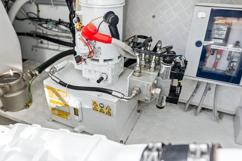 Mako Yacht Photos Pics Engine compartment of a 2024 Maori M46, showcasing mechanical components and wiring.