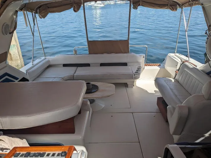 Irrational Exuberance Yacht Photos Pics 1994 Sea Ray 400 Express yacht interior with spacious seating and ocean view.