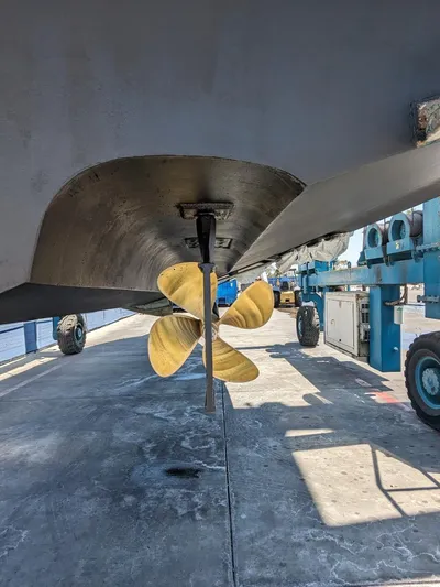Irrational Exuberance Yacht Photos Pics 1994 Sea Ray 400 Express boat propeller and hull in dry dock.