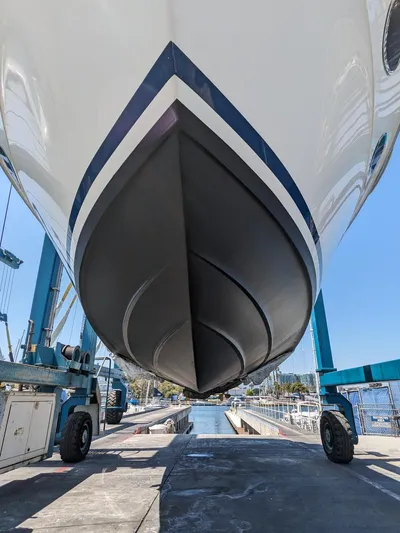 Irrational Exuberance Yacht Photos Pics 1994 Sea Ray 400 Express yacht hull in dry dock, showcasing sleek design and craftsmanship.