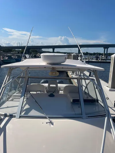 Working Girl Yacht Photos Pics 2008 Grady-White Open Express boat docked under clear blue sky.