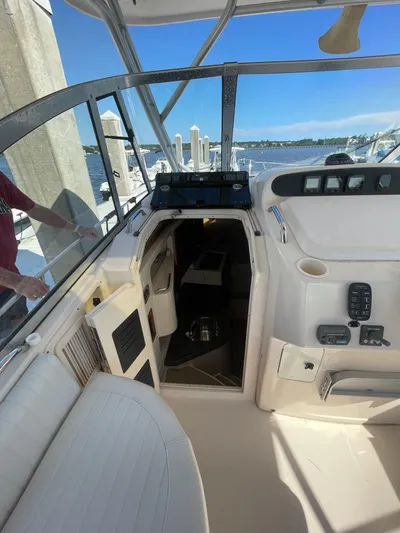 Working Girl Yacht Photos Pics 2008 Grady-White Open Express boat interior with seating and control panel.