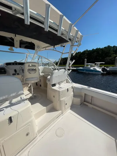 Working Girl Yacht Photos Pics 2008 Grady-White Open Express boat interior, docked on a sunny day.