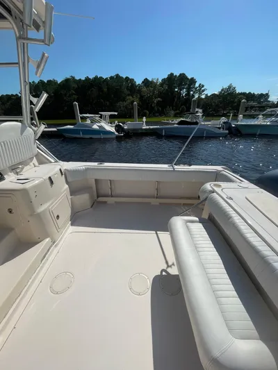 Working Girl Yacht Photos Pics 2008 Grady-White Open Express boat interior at marina, sunny day.