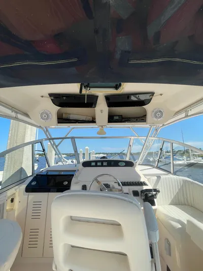 Working Girl Yacht Photos Pics 2008 Grady-White Open Express boat interior with steering wheel and dashboard view.