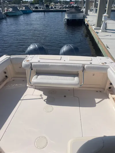 Working Girl Yacht Photos Pics 2008 Grady-White Open Express boat at marina, featuring dual outboard motors.